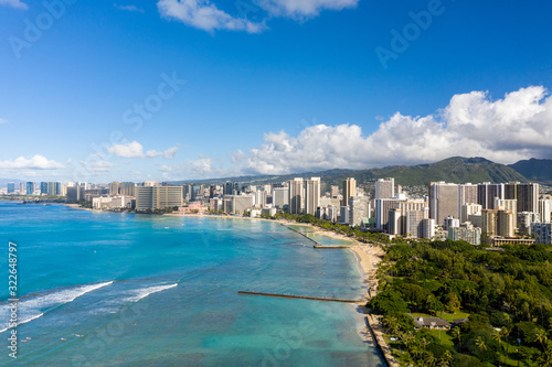 Aerial drone view of the sea front on Waikiki with Honolulu in the background © steheap