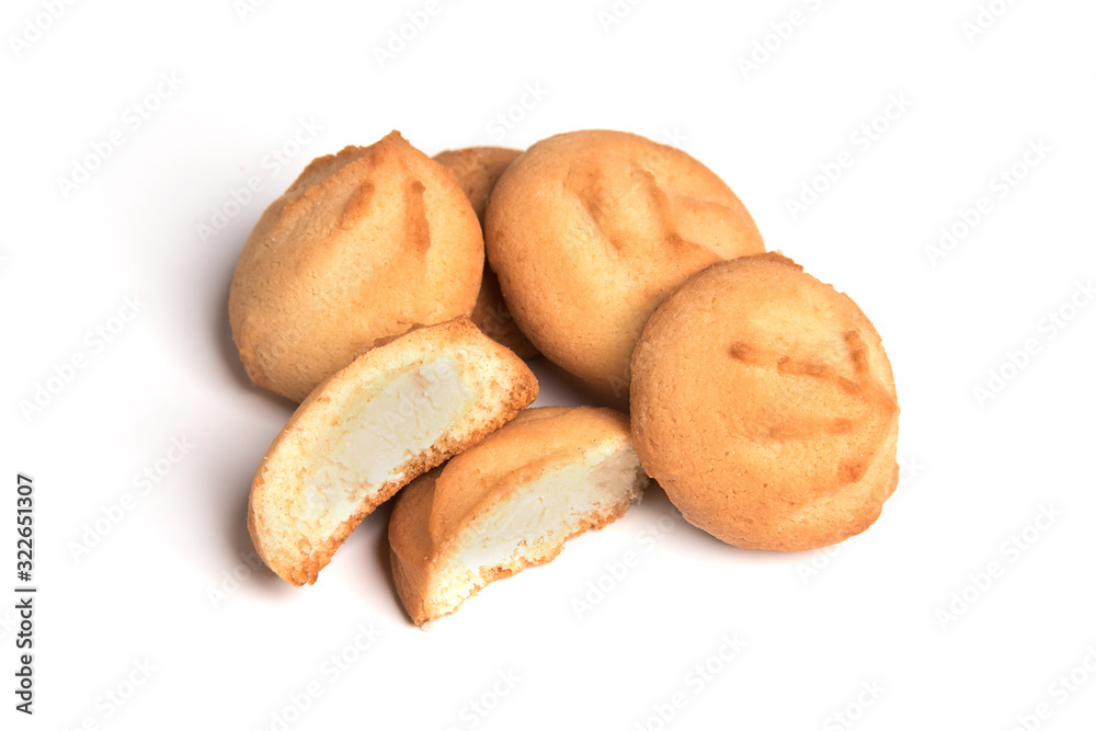 Cookies with milk filling in a cut isolated on a white background. Cookies with milk filling in a cut isolated on a white background.