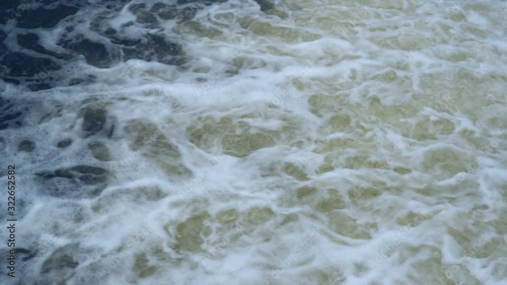 A large amount of water from the reservoir pours down. The water mass boils and foams creating a strong flow. A large amount of water from the reservoir pours down. The water mass boils and foams creating a strong flow.