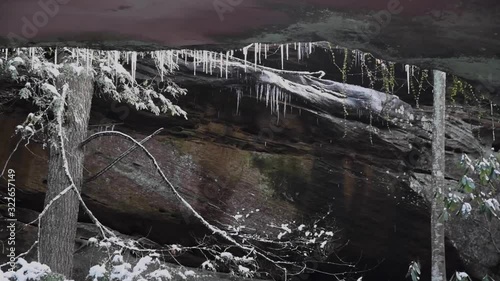 Ice Melting From Natural Stone Bridge at Pickett CCC Memorial State Park in Winter photo