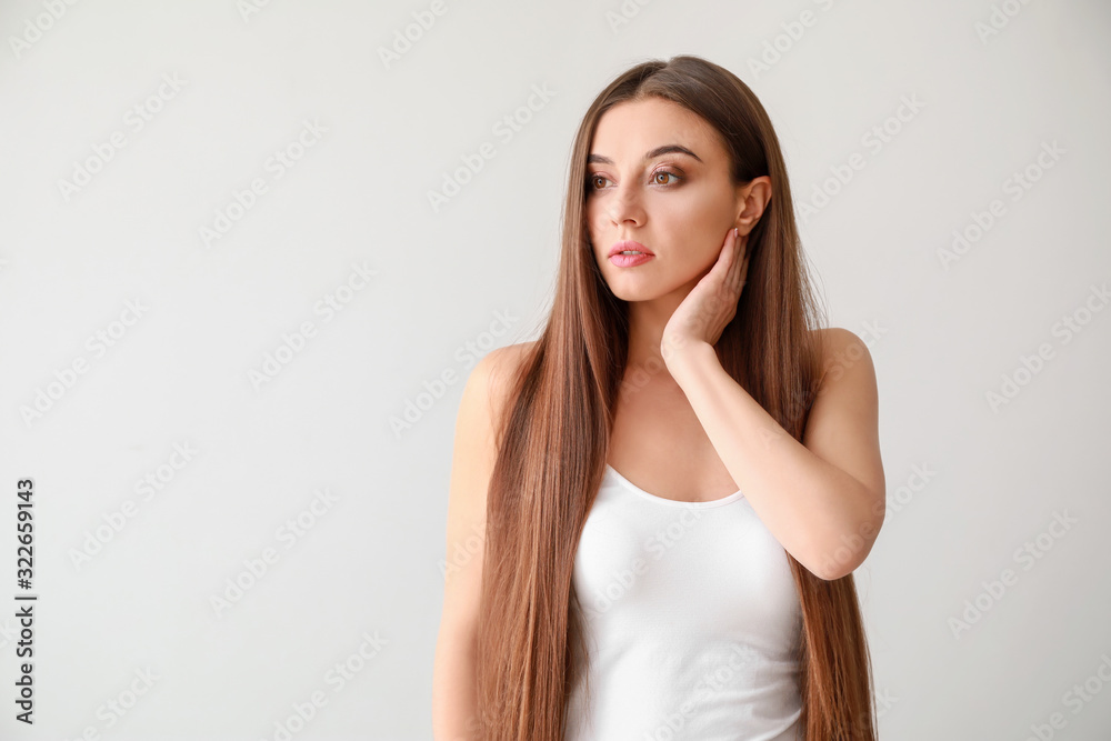 Beautiful woman with healthy long hair on white background Beautiful woman with healthy long hair on white background