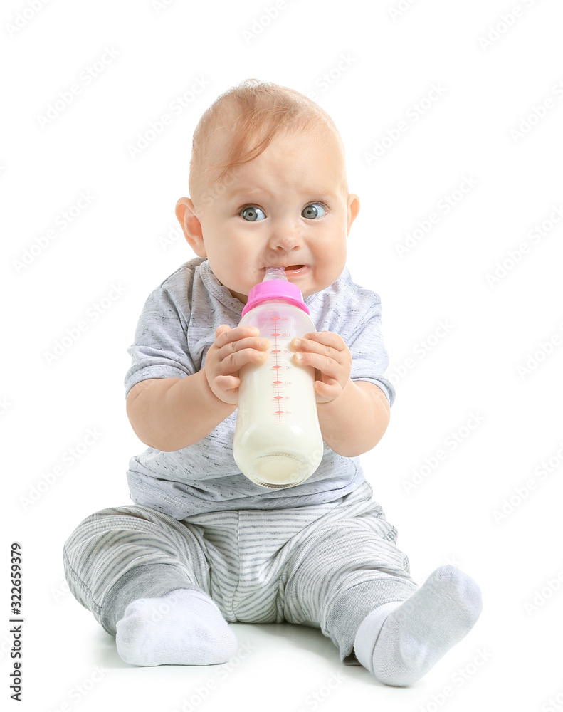 Baby with bottle of milk on white background Baby with bottle of milk on white background