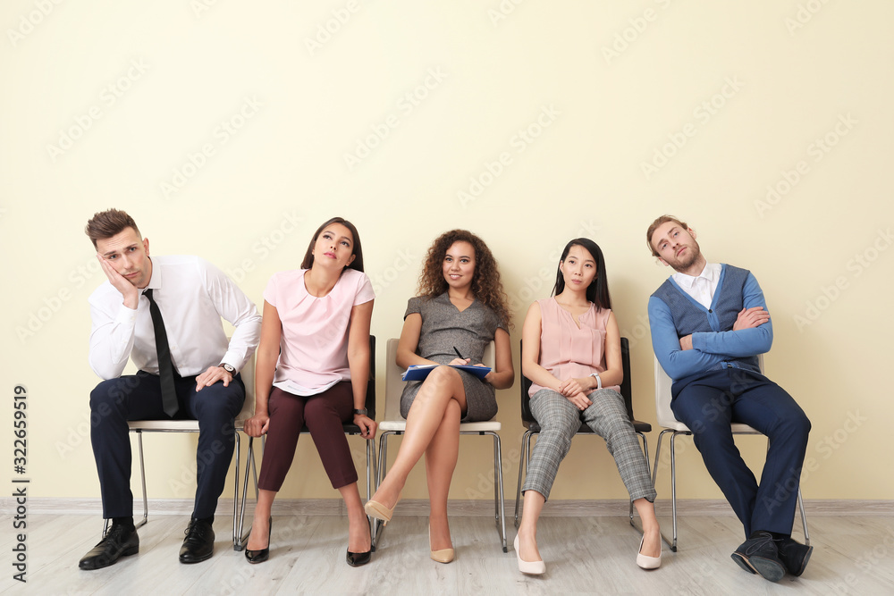 Young people waiting for job interview indoors Young people waiting for job interview indoors