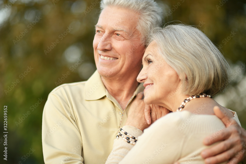 Portrait of smiling senior couple in autumn park Portrait of smiling senior couple in autumn park