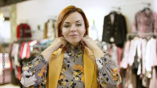 Wallpaper Mural Pretty adult short haired woman is looking to the camera and tounching her hair at clothing store at mall Torontodigital.ca