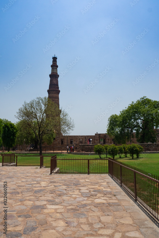 Qutb Minar Complex, with the impressive Qutub Minar in the background. Delhi, India.