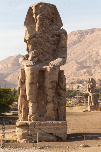 Colossi of Memnon are two massive stone statues Pharaoh Amenhotep III, who reigned in Egypt during the Dynasty XVIII.