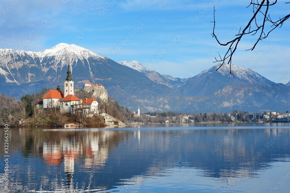 Lake Bled Slovenia. Beautiful mountain lake with small Pilgrimage Church. Most famous Slovenian lake and island Bled with Pilgrimage Church of the Assumption of Maria and Bled Castle in background.