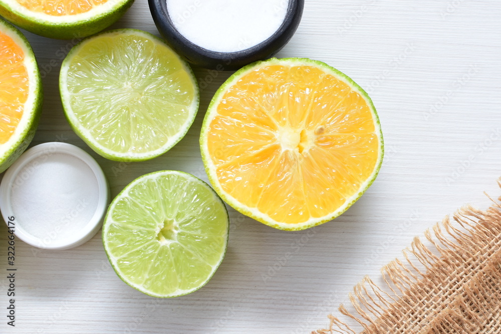 Tahiti lemons and whole and sliced oranges Tahiti lemons and whole and sliced oranges