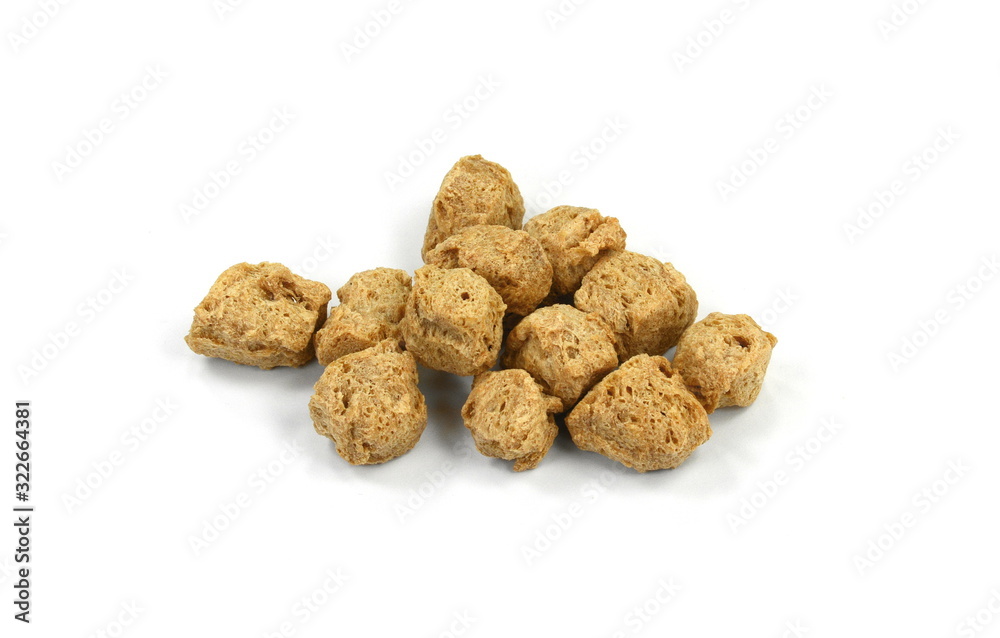 Raw dehydrated soy meat on white background. Pieces of dry soy meat. Textured Soy Protein. Raw dehydrated soy meat on white background. Pieces of dry soy meat. Textured Soy Protein.