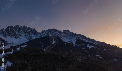 Dolomites Mountain in winter, by San Candido, Alto Adige Italy. Sunrise in Monte Baranci Haunold. Aerial drone shot in january 2020 © Сергій Вовк