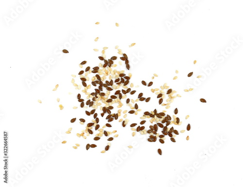 Organic Linseed or Flaxseed (Linum usitatissimum) and sesame isolated on white background.