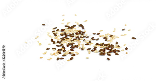 Organic Linseed or Flaxseed (Linum usitatissimum)  and sesame isolated on white background.