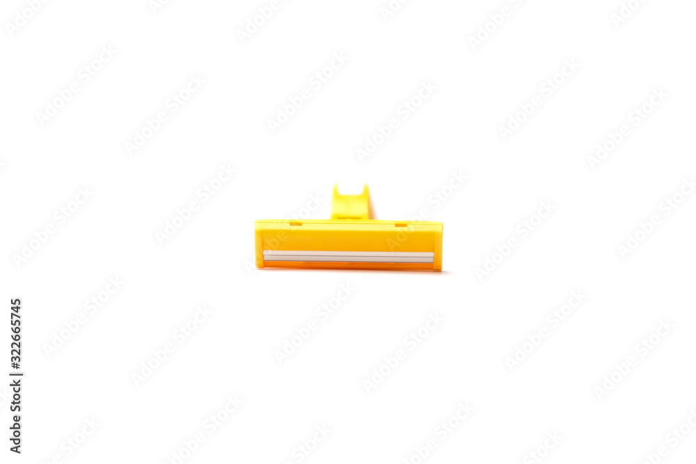 Yellow plastic shaver isolate on white background