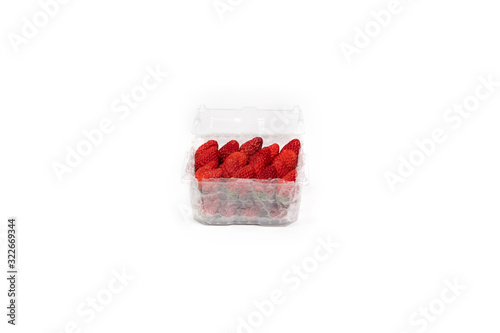Fresh Asia Strawberry are arranged in premium packaging plastic box with bubble wrap inside on the white background. Clipping path.