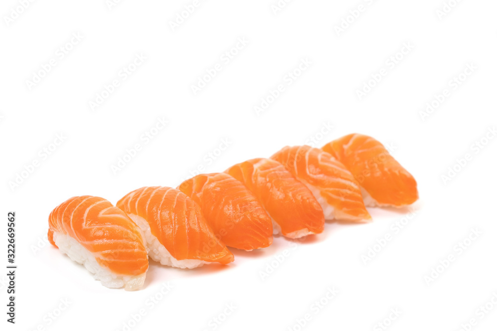 a Group of Sushi Salmon in the row on the whire background. This it the traditional Japanese food eat between raw fresh salmon and rice. a Group of Sushi Salmon in the row on the whire background. This it the traditional Japanese food eat between raw fresh salmon and rice.