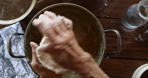 Top view preparing food. Cooking With Grandma. Beautiful Little Girl Learns How To Make Cookies.