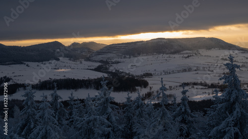 Panoramic view from Borowa Gora view point during winter time. Frosty structure, glazed, icy branches. Walbrzych in the background, Lower Silesia, Poland photo