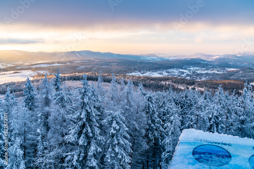 Panoramic view from Borowa Gora view point during winter time. Frosty structure, glazed, icy branches. Walbrzych in the background, Lower Silesia, Poland