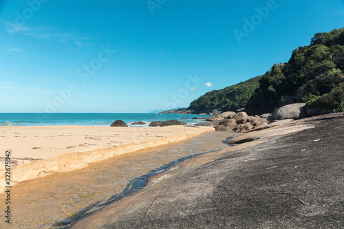 Beautiful Parnaioca beach with crystal blue water and stones  deserted tropical beach on the sunny coast of Rio de Janeiro  Ilha Grande in the city of Agnra dos Reis  Brazil