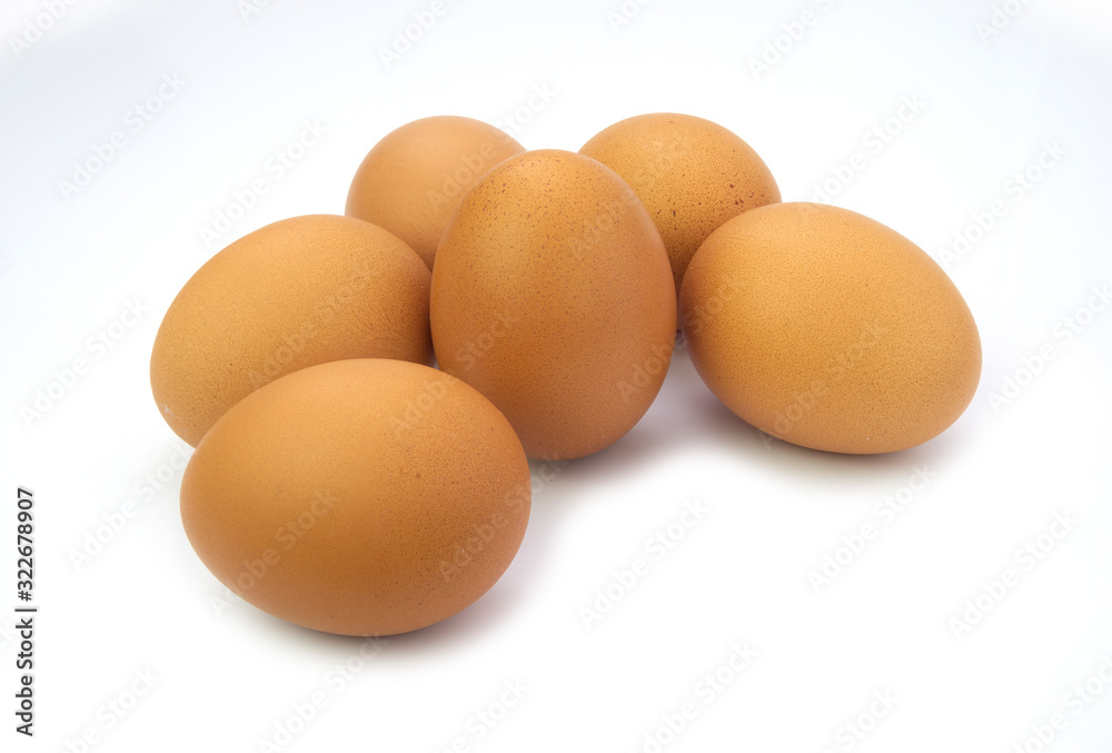 Six brown organic chicken eggs isolated on white background Six brown organic chicken eggs isolated on white background