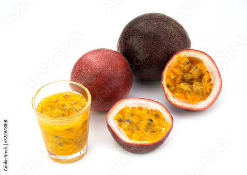 Fresh tropical whole   half and juice passion fruits  isolated on white background