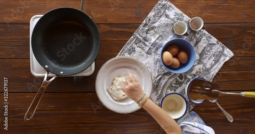 Top view food. Cooking With Mother. Beautiful Little Girl Learns How To Make Fried Egg.