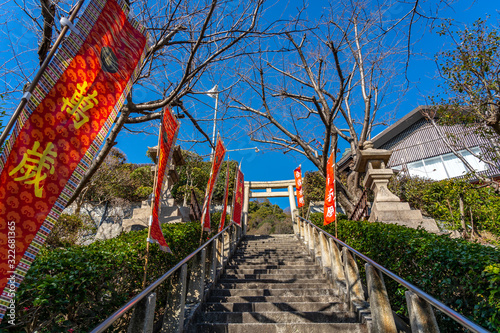 Kitano Tenman jinja Shrine in sunny day, near by the Kitano Ijinkan Gai street. Kobe City, Hyogo Prefecture, Japan photo