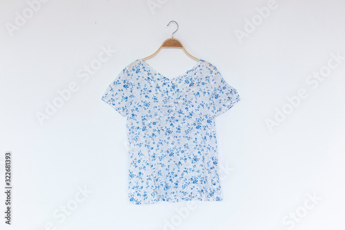 Woman blouse with blue blouse cotton on white background.