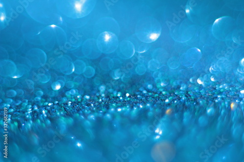 festive lighting and decoration concept - New Year's garland side lights on a blue background