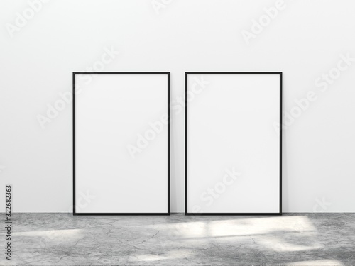 Fototapeta Naklejka Na Ścianę i Meble -  Two vertical black frame mock up on concrete floor with light overlays. Set of two black frame mock up poster. 2 vertical frame 3d illustrations.