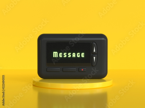 black mobile pager old technology yellow background