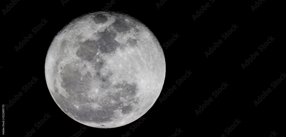 Obraz premium Full moon texture / It is the fifth-largest satellite in the Solar System, and by far the largest among planetary satellites relative to the size of the planet that it orbits.