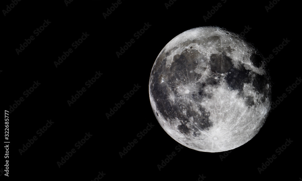 Obraz premium Full moon texture / It is the fifth-largest satellite in the Solar System, and by far the largest among planetary satellites relative to the size of the planet that it orbits.