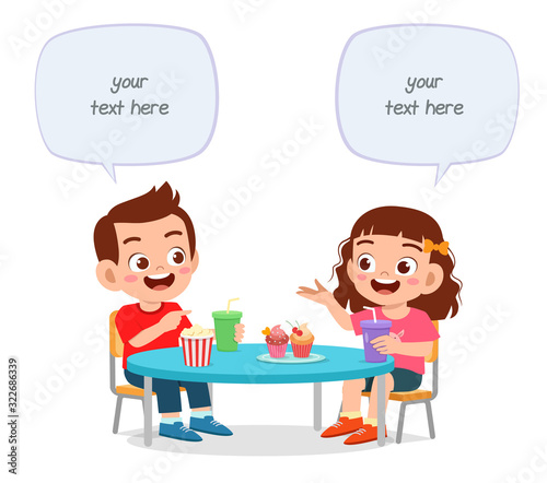 happy cute little kids boy and girl lunch together