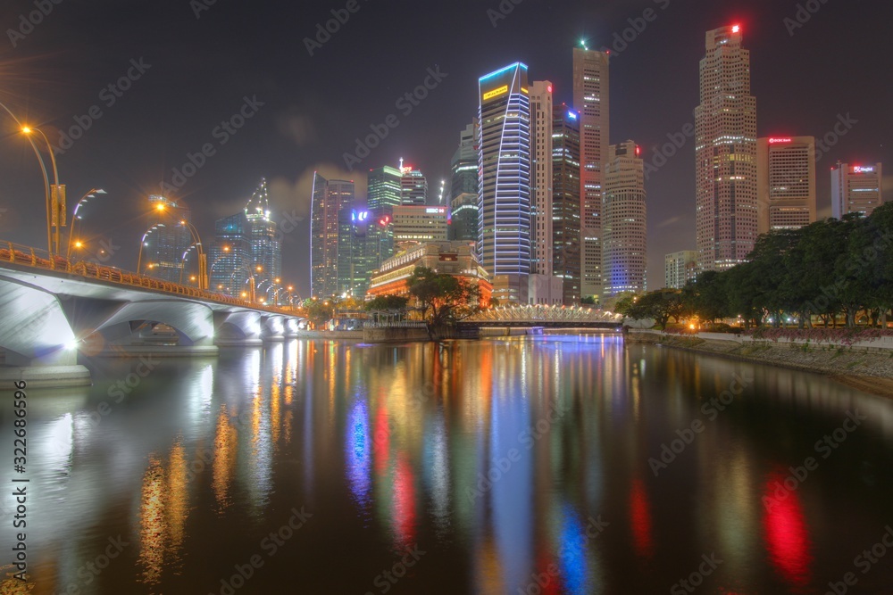 Singapore skyline at night with reflection