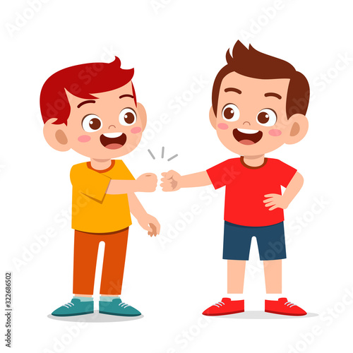 happy cute little kids boys fist bump