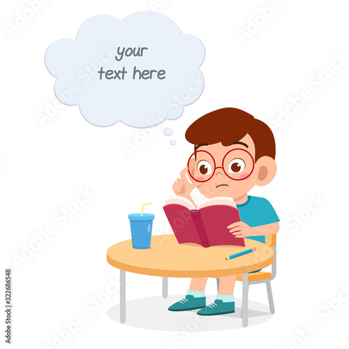 happy cute little kid boy study for test