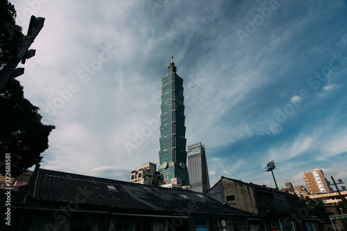 Taipei 101 tower and old vintage city village town in Taiwan with cloudy blue sky background landscape photo