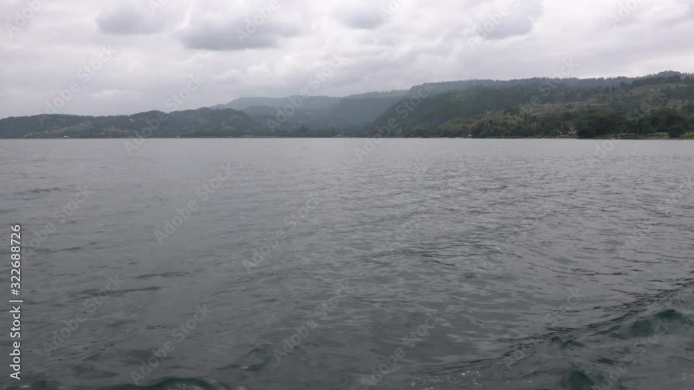 On a boat motoring across the beautiful Lake Toba in Indonesia. On a boat motoring across the beautiful Lake Toba in Indonesia.