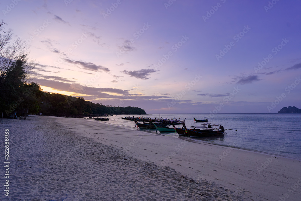 Travel by Thailand. Landscape with traditional longtail fishing boat on the sea beach.