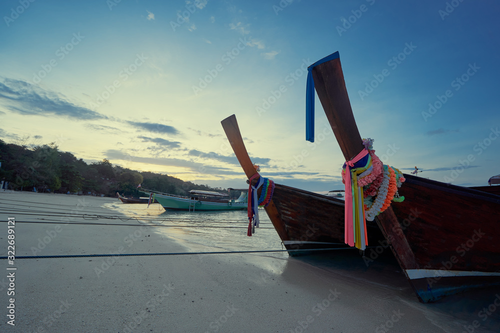 Fototapeta premium Travel by Thailand. Landscape with traditional longtail fishing boat on the sea beach.