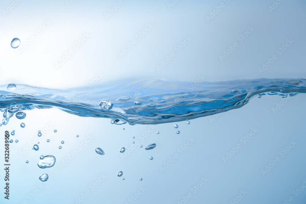 Water splash. Aqua flowing in waves and creating bubbles. Drops on the water surface feel fresh and clean. isolated on white background.