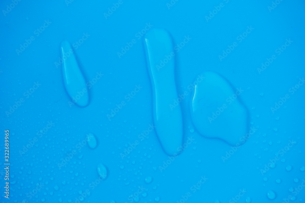 Water Drops On Blue Background.