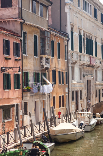 VENICE, ITALY - JUNE 15, 2016  Typical Venetian buildings on the waterfront along the venetian canal photo