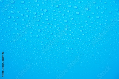 Water Drops On Blue Background.