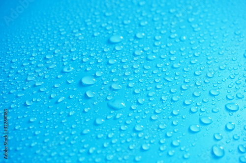 Water Drops On Blue Background.