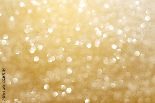 Abstract golden bokeh light with out of focus glister background