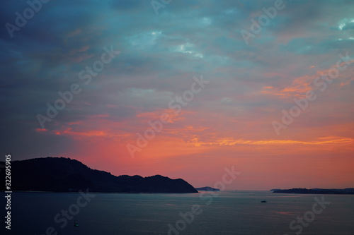 Beautiful landscape. Colorful sunset on the sea shore. © luengo_ua