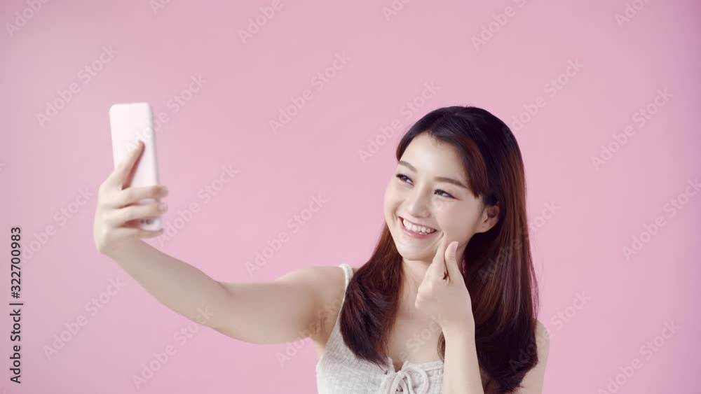 Happy young asian woman taking selfie Happy young asian woman taking selfie